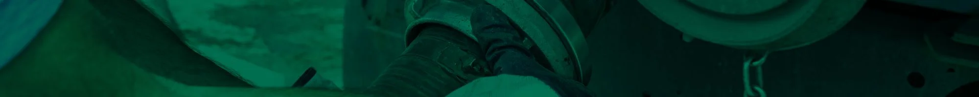 Action Septic vacuum truck pumping a residential septic tank in the Okanagan